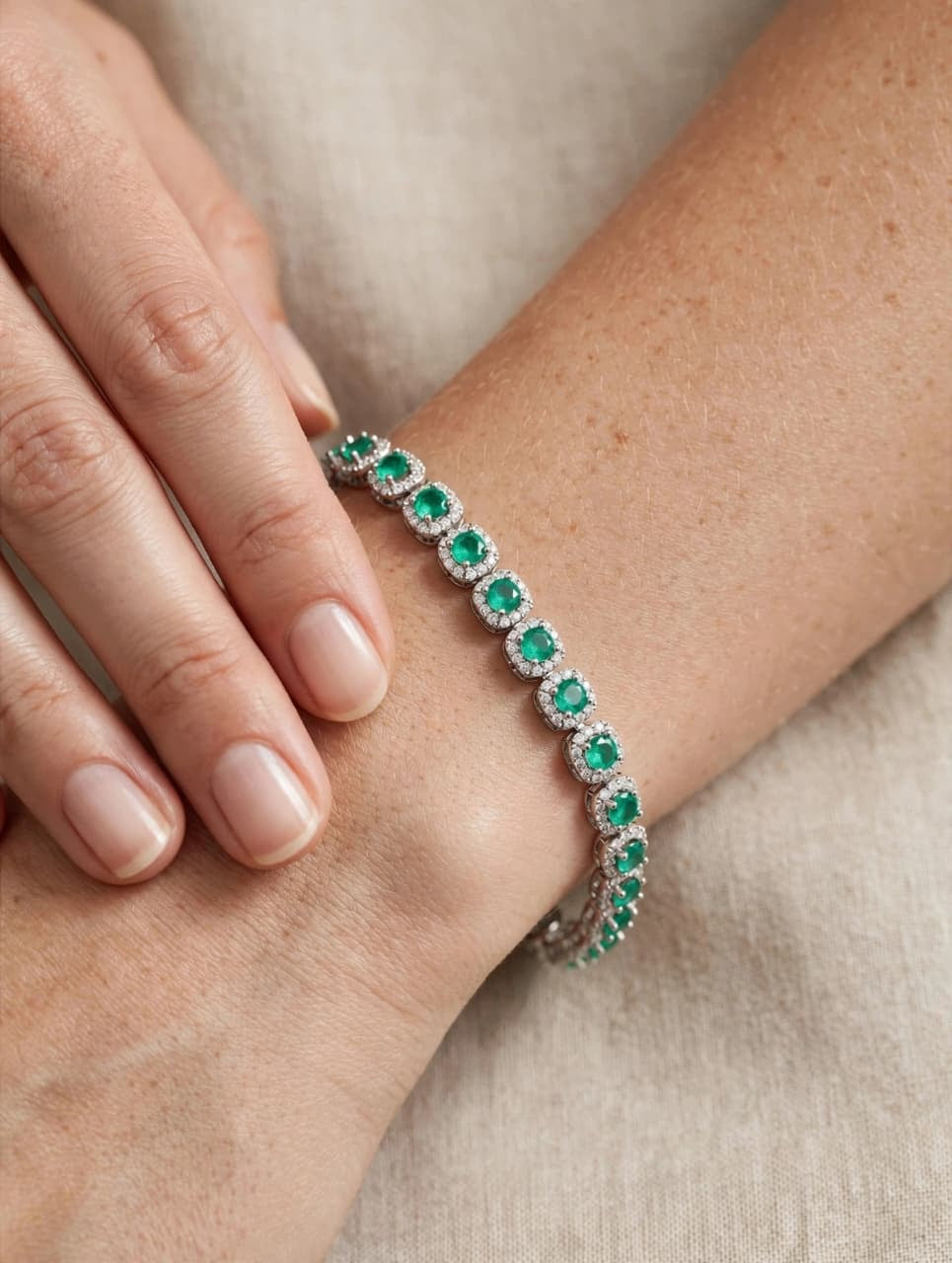 The Ava Emerald Halo Tennis Bracelet